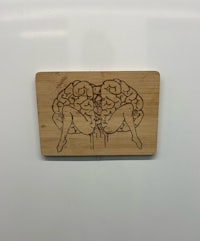 a piece of wood with a drawing of a brain on it